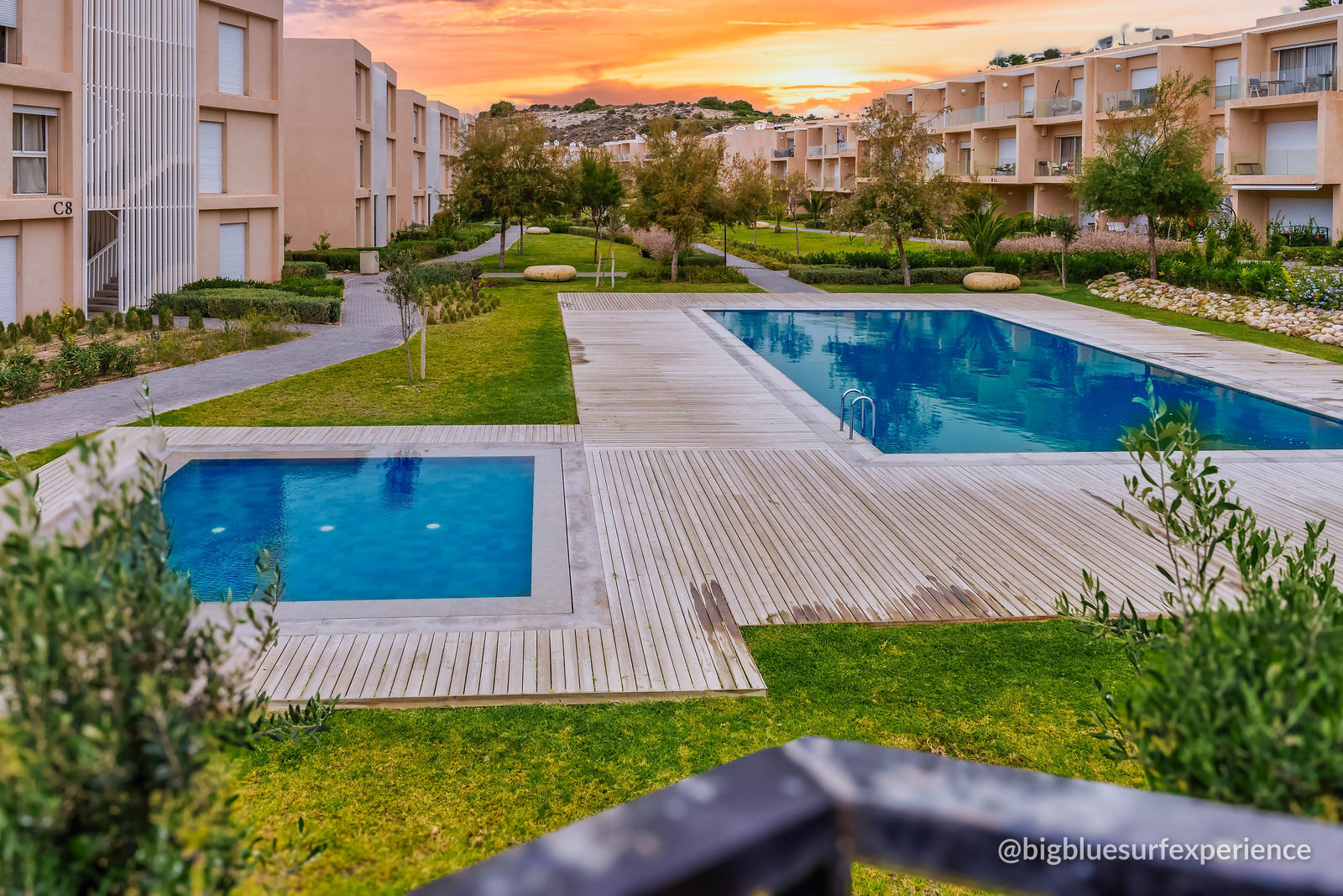 The two residence pools at sunset, seen from the Bay Duplex terrace