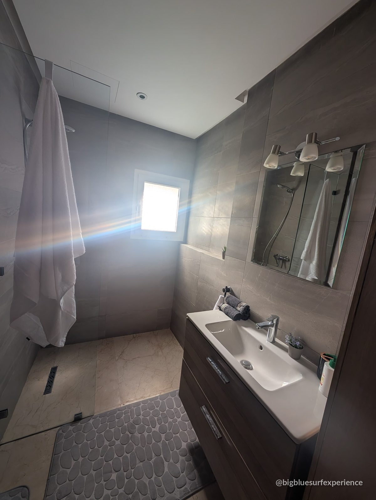 Second bathroom of the BigBlue Bay Studio, off the living room, with a walk-in shower