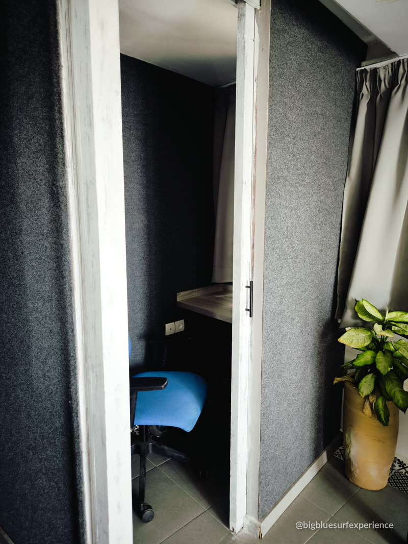 Soundproofed call booth with desk and chair for video meetings