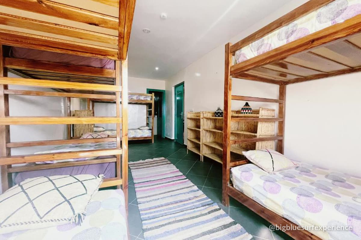 Shared dormitory with wooden bunk beds