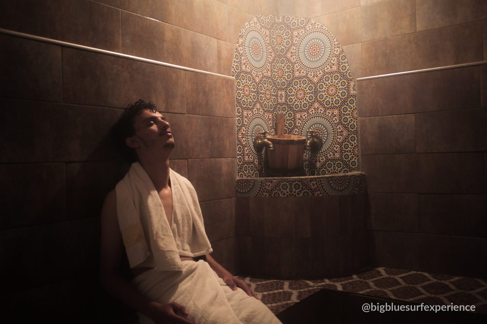 Traditional onsite hammam at BigBlue Surf Hostel with zellige mosaic and a wooden bucket